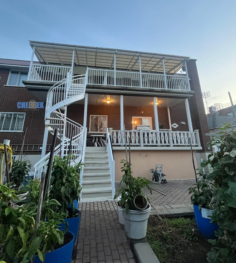 Staircase, balcony, and aluminum awning after installation