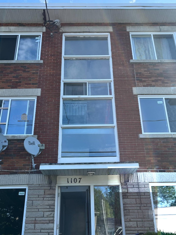 Apartment building windows before replacement